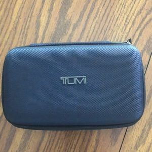 Never used Tumi travel case.  Hard side.